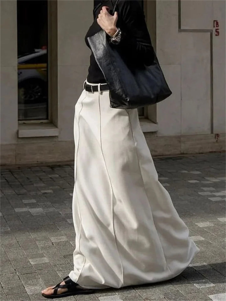Élégante jupe à coupe en H au design simple et raffiné, parfaite pour un look classique et sophistiqué