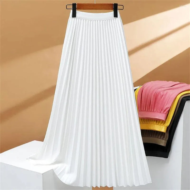 Jupe longue plissée extensible à taille haute, élégante et confortable, parfaite pour un look sophistiqué et féminin.