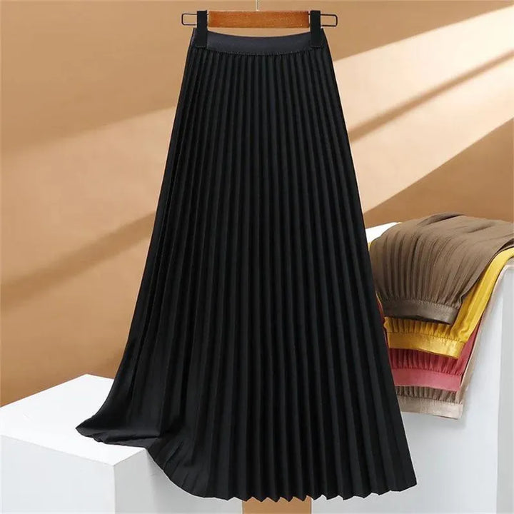 Jupe longue plissée extensible à taille haute, élégante et confortable, parfaite pour un look sophistiqué et féminin.