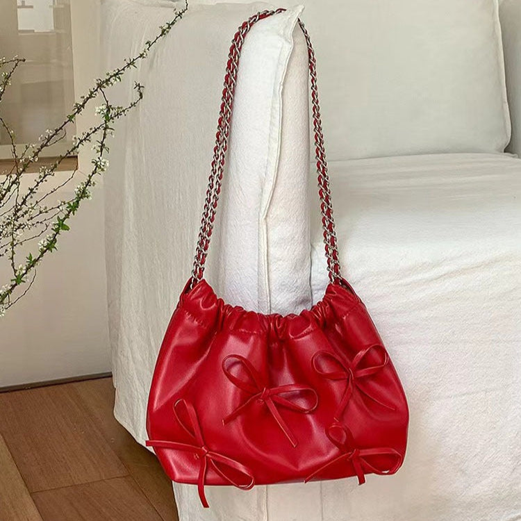 Sac à bandoulière en cuir verni de style romantique avec nœuds - Léonie